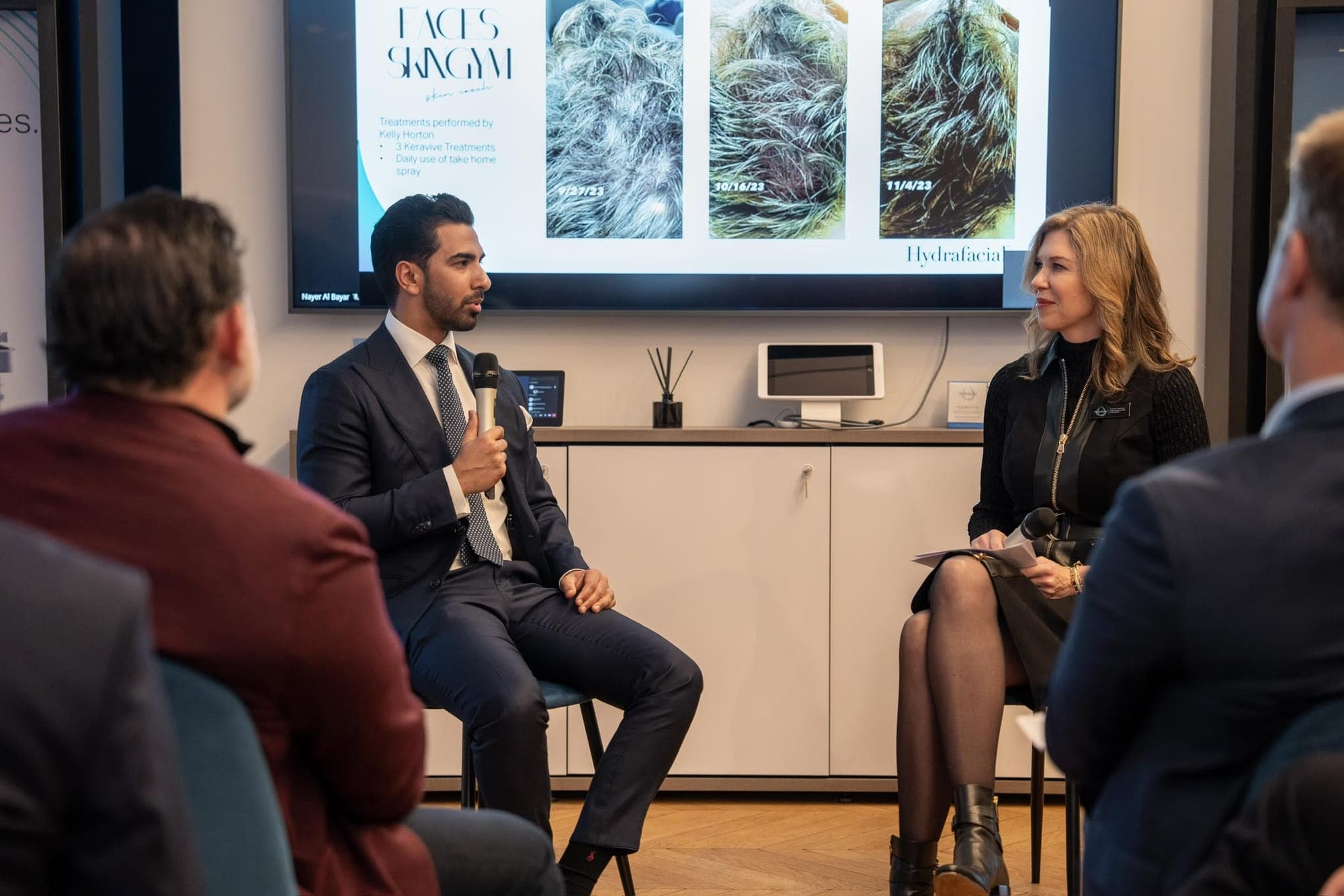 Dr Kamran Amjed speaking on an expert panel at a clinic industry event